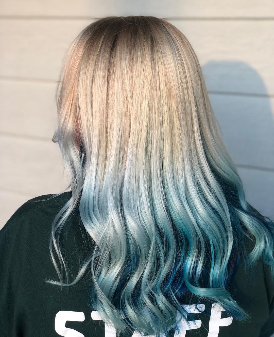 Ice blue peekaboo highlights on silver blonde hair