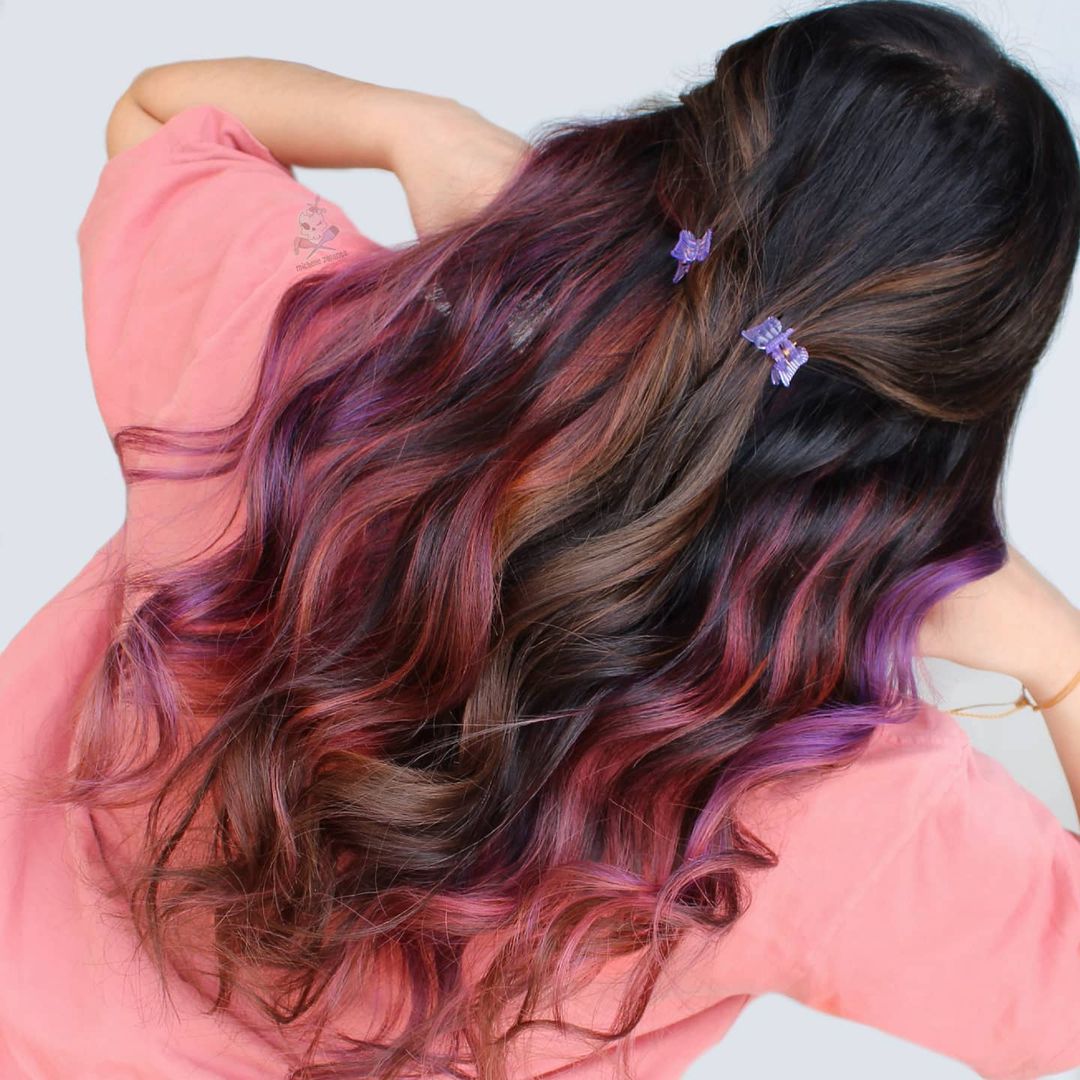 Rainbow peekaboo highlights under brown hair
