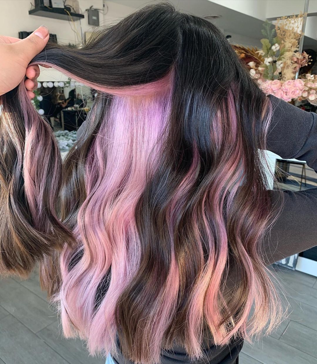 Hot pink peekaboo highlights under dark brown hair